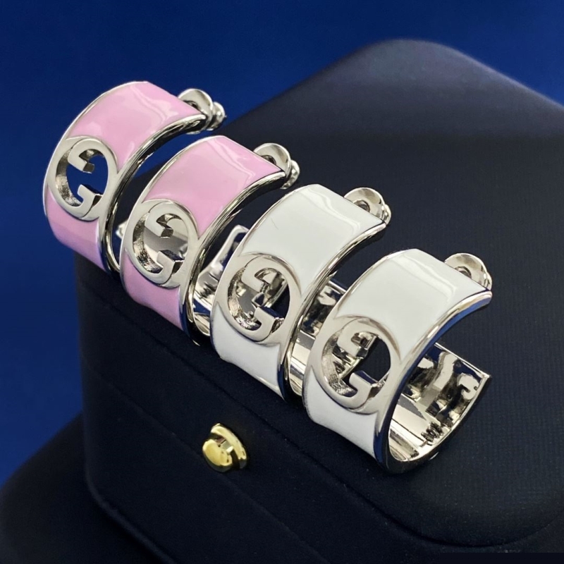 G*u*i earrings